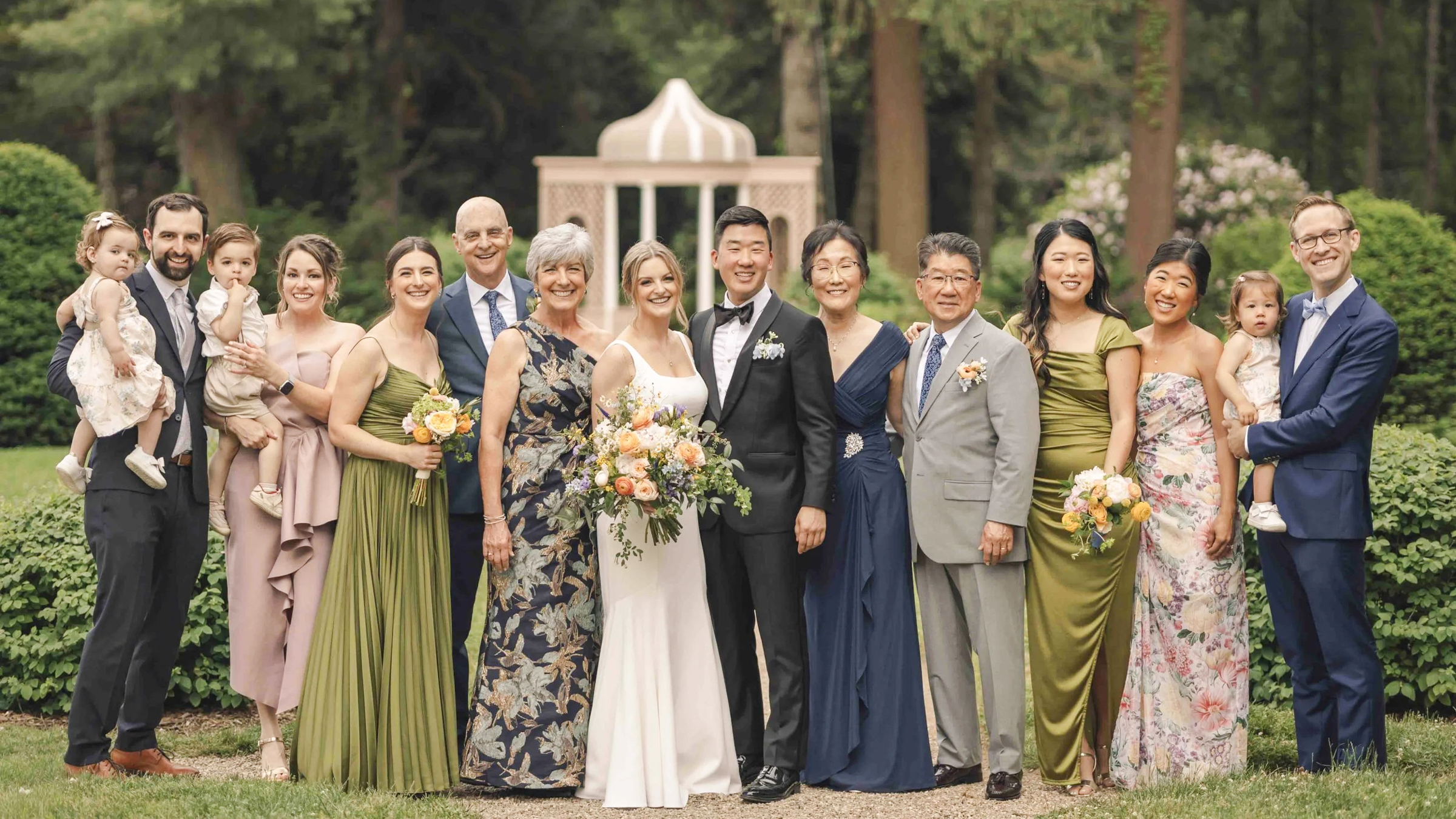 Boston Wedding Family Photo Guide 1 Large family group portrait smiling on garden path near gazebo