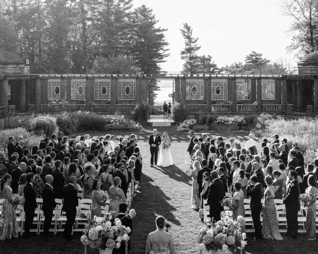 A second videographer captures guests during a wedding ceremony, documentary wedding film coverage by Mark Davidson