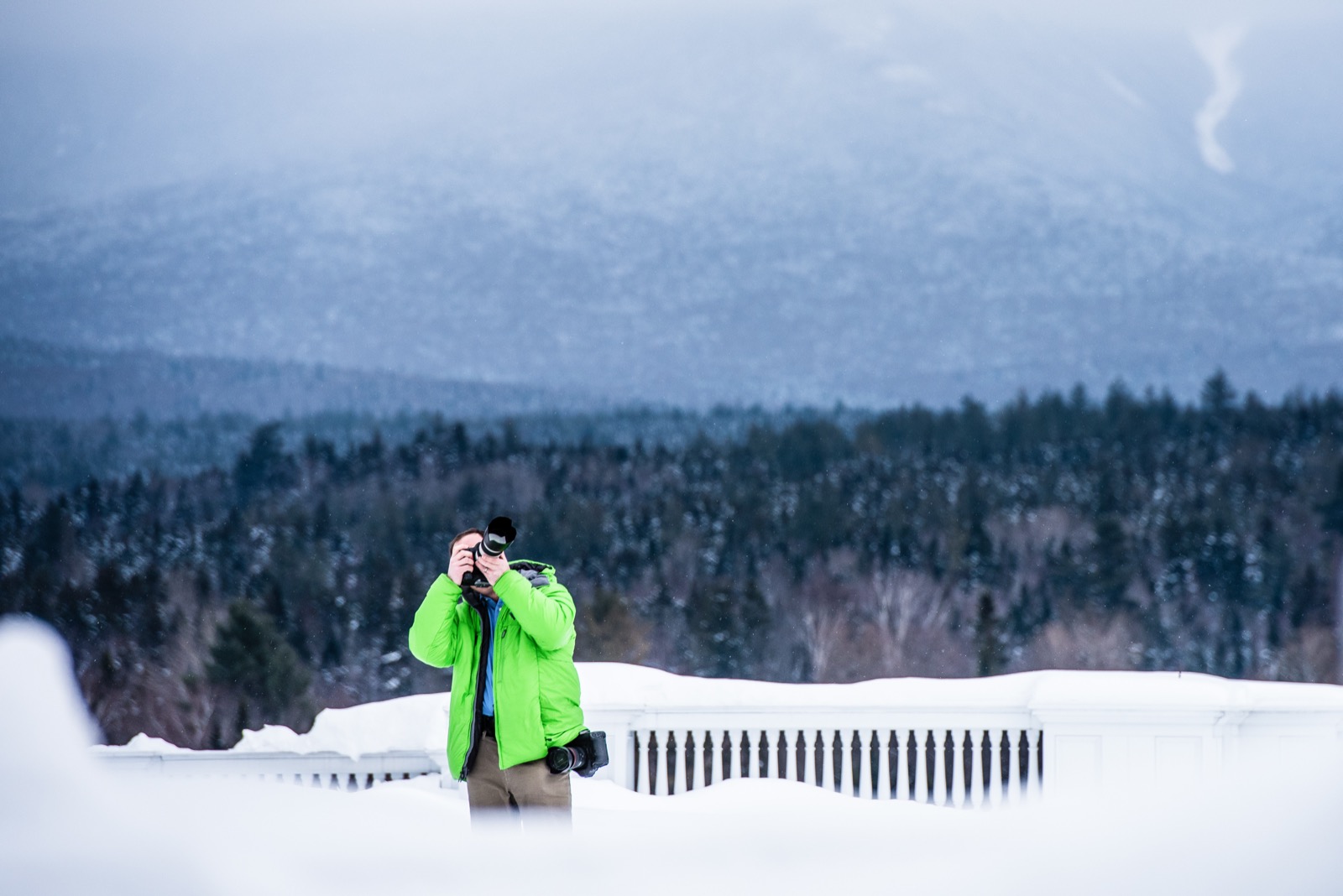 Eric photographing in falling snow on a terrace below the White Mountains in New Hampshire