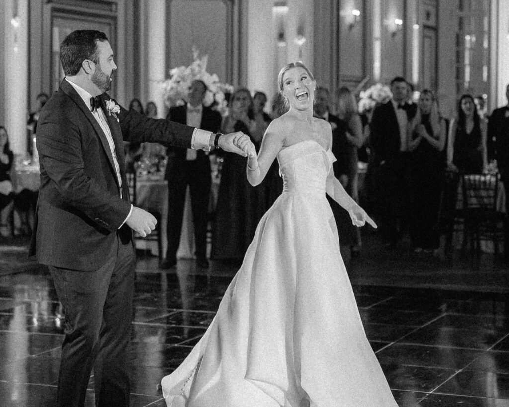Bride laughing during the first dance at a Boston wedding reception, documentary wedding video coverage