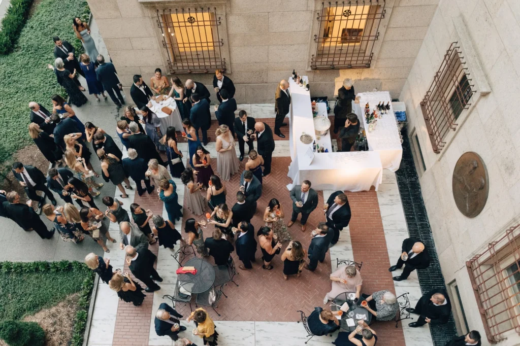 The Boston Public Library courtyard seen from the upper arcade as guests gather for a ceremony