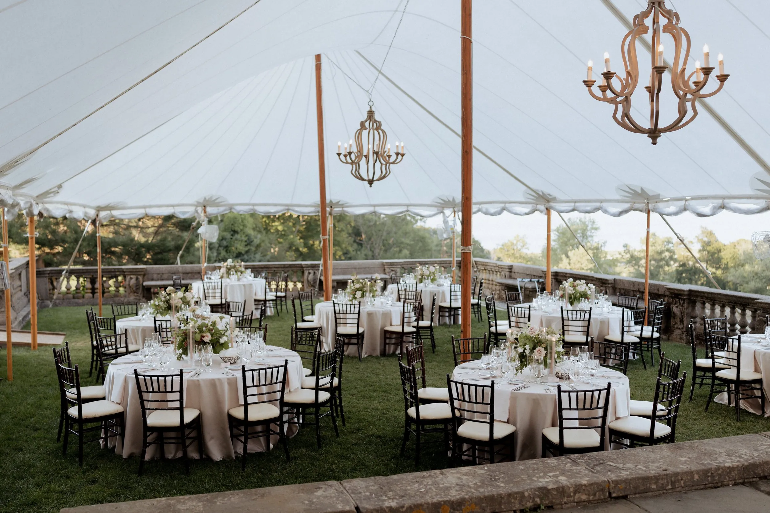 Sailcloth tent with chandeliers set for dinner on the Great House terrace
