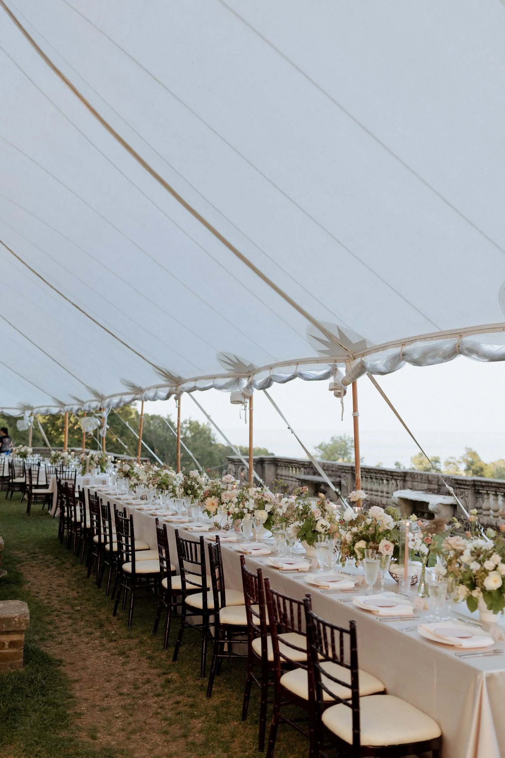 Long dinner table under the sailcloth tent at the Crane Estate
