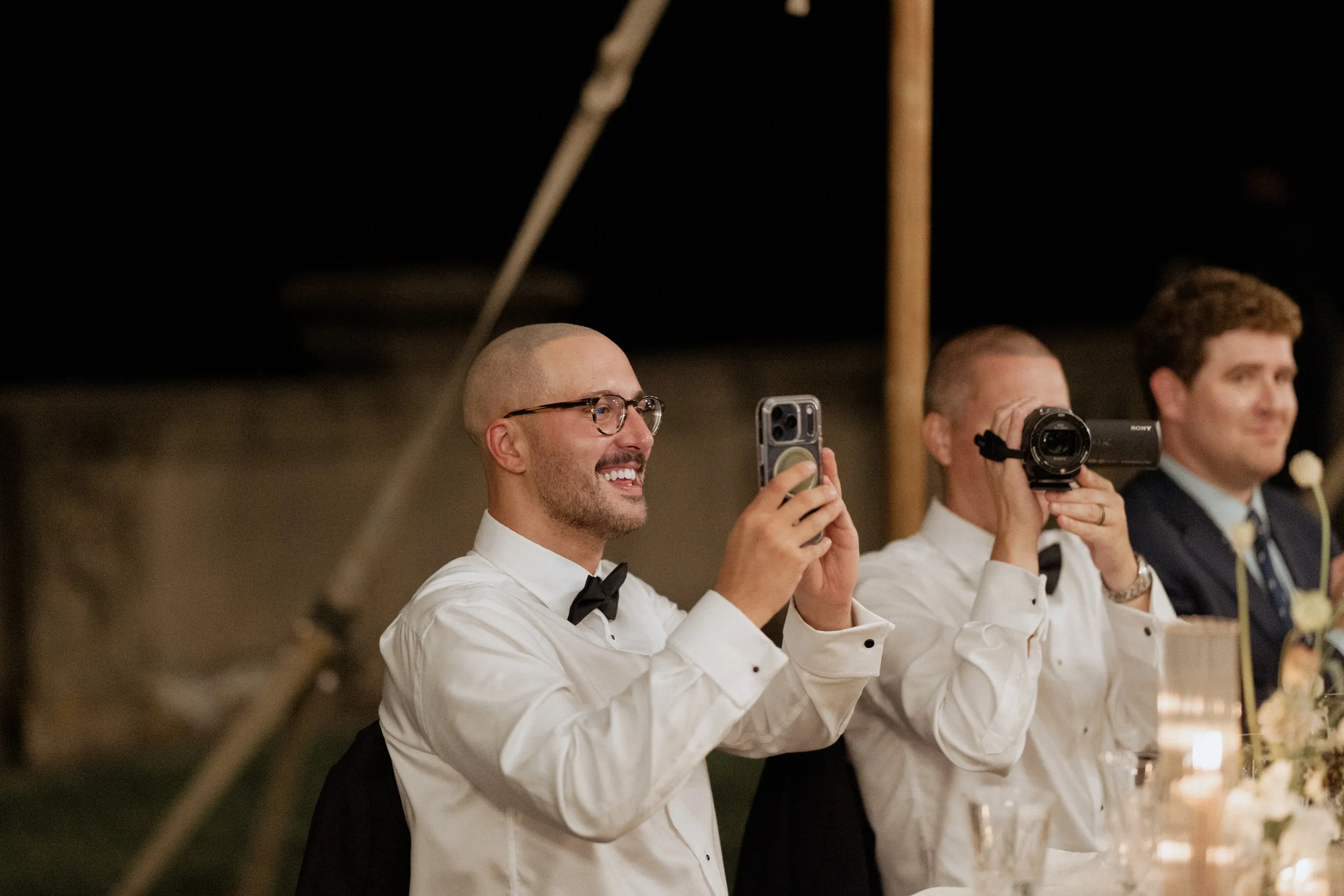 Guests filming the speeches on their phones