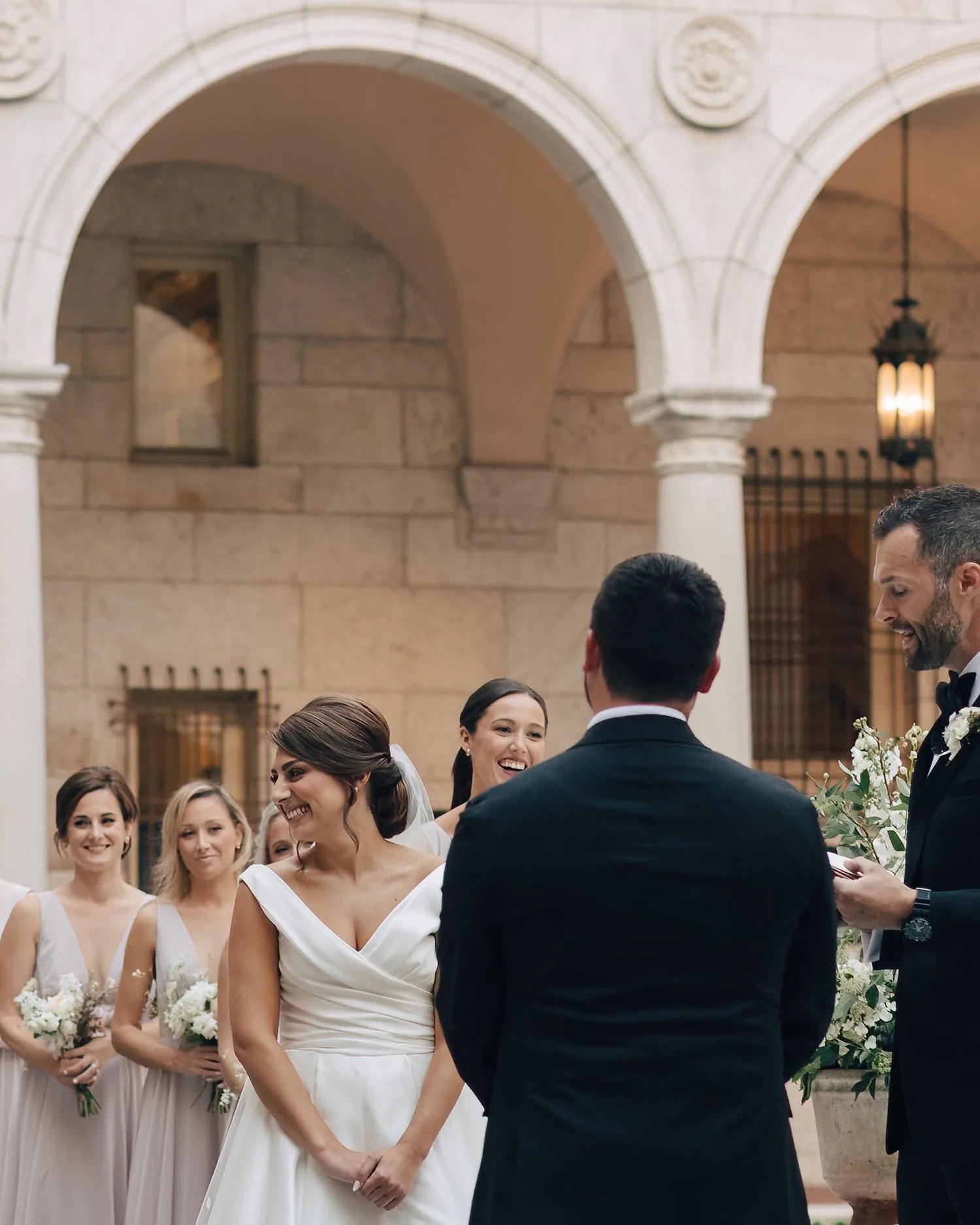 A ceremony under the arches of the Boston Public Library courtyard