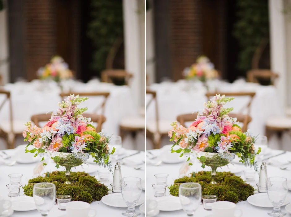 Pink, coral and white garden flower centerpieces on moss at a Tower Hill Botanic Garden wedding reception