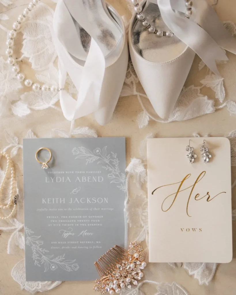 Wedding invitation suite, shoes and jewelry photographed in window light at Tupper Manor